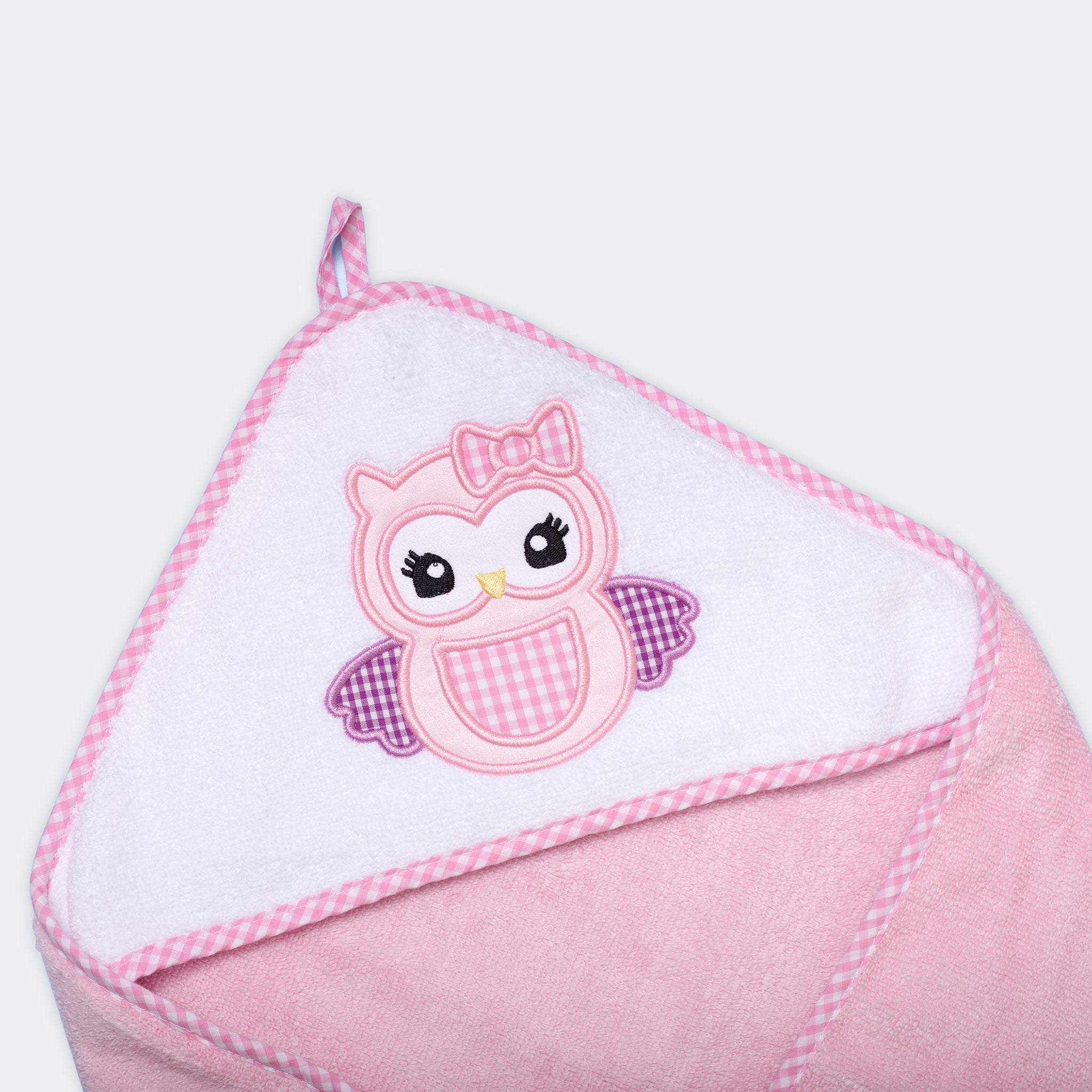 "Baby hooded towel with an owl design, crafted from gentle and absorbent fabric for babies."