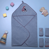 "Olly & Lily baby hooded towel set with a fun boat design, perfect for keeping your little one cozy after bath."