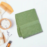 Plush cotton towel stacked on a shelf, offering a fluffy feel and plush texture for luxurious drying.