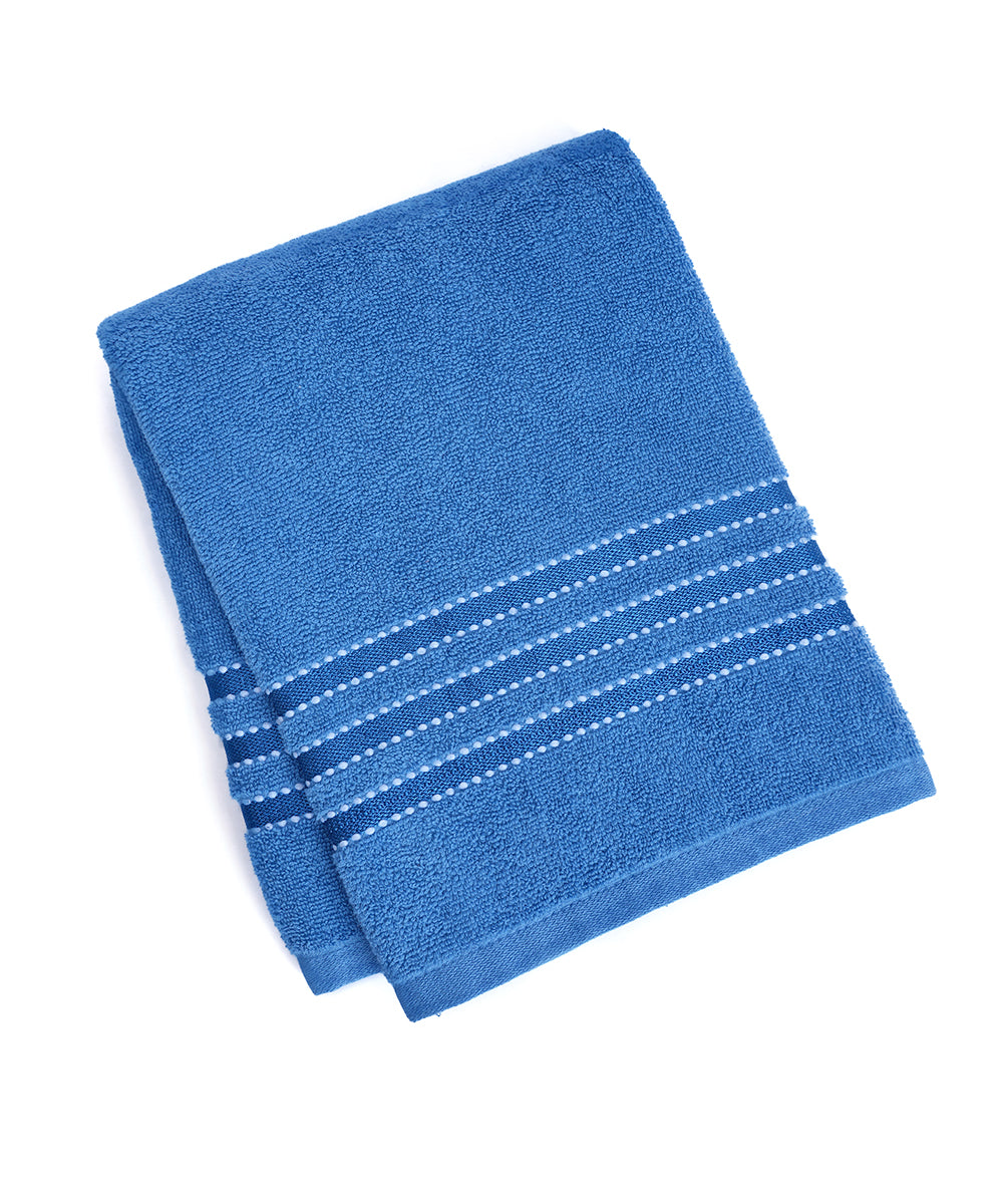 Close-up view of cotton Prime Club Rivera towel showing soft fibers and plush texture.