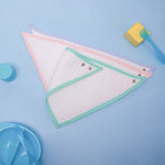 "Natural cotton baby dribbler bib designed for softness and absorbency."