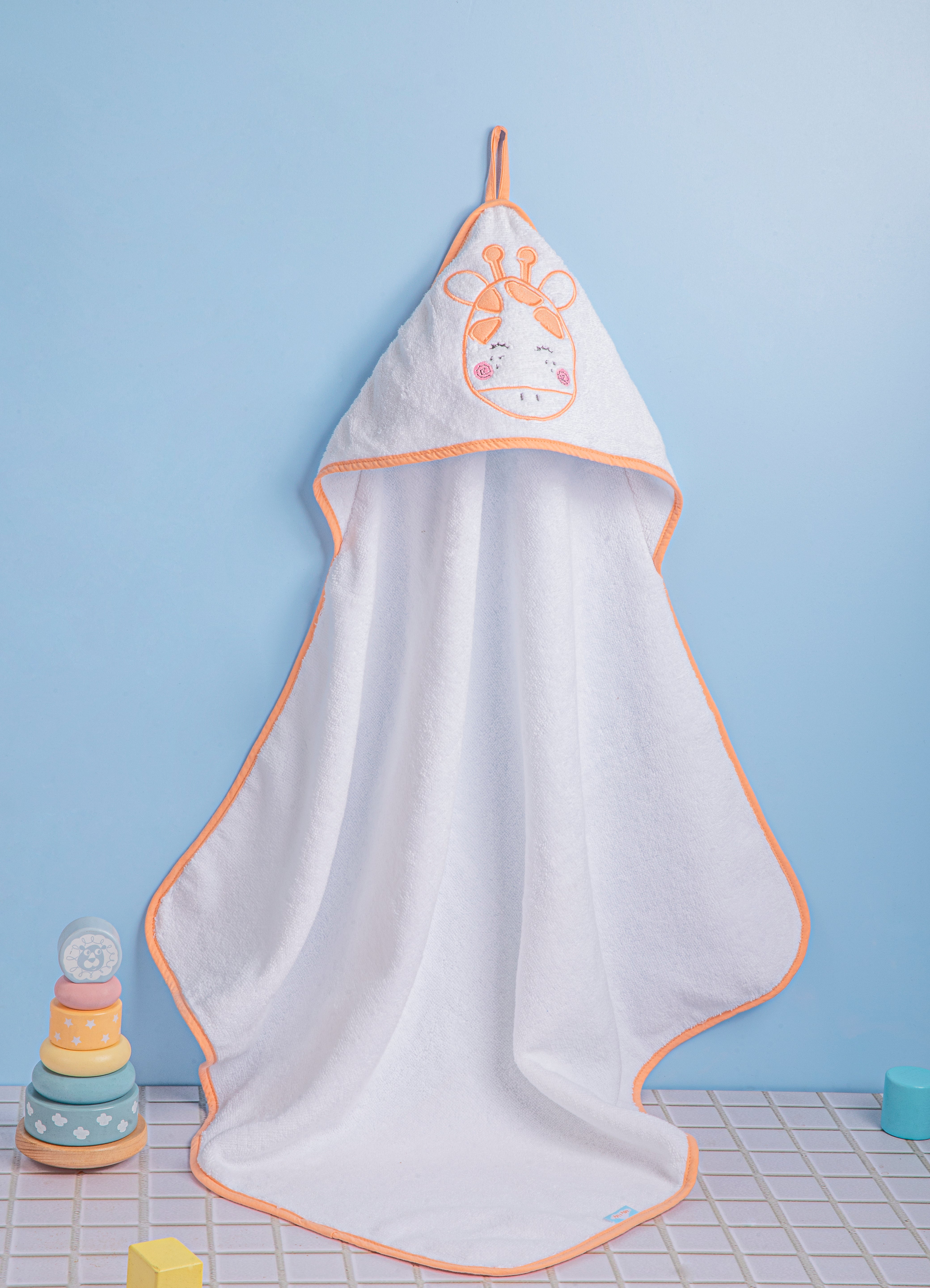 "Olly & Lily baby hooded towel with an adorable cow design, perfect for keeping your baby cozy and warm."