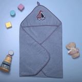 "Unique Olly & Lily baby hooded towel with a boat design, perfect for cozy and fun bath times."