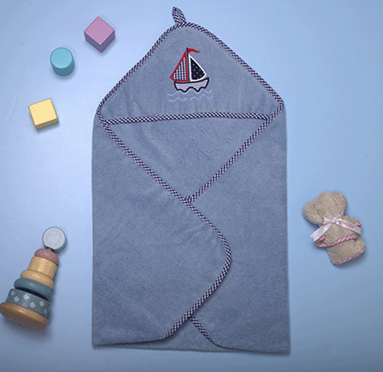 "Unique Olly & Lily baby hooded towel with a boat design, perfect for cozy and fun bath times."