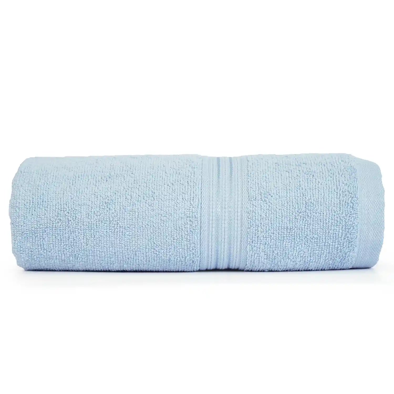 Soft cotton bath towel draped over a bathtub, providing ultimate relaxation and comfort after a bath.